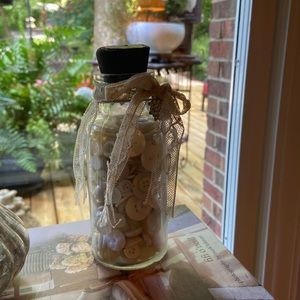 Glass jar of vintage buttons